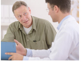 doctor talking to male patient
