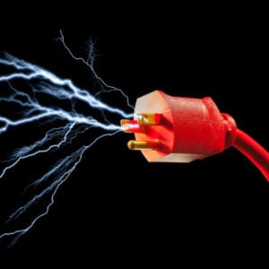 extension cord with electricity shooting out from prongs